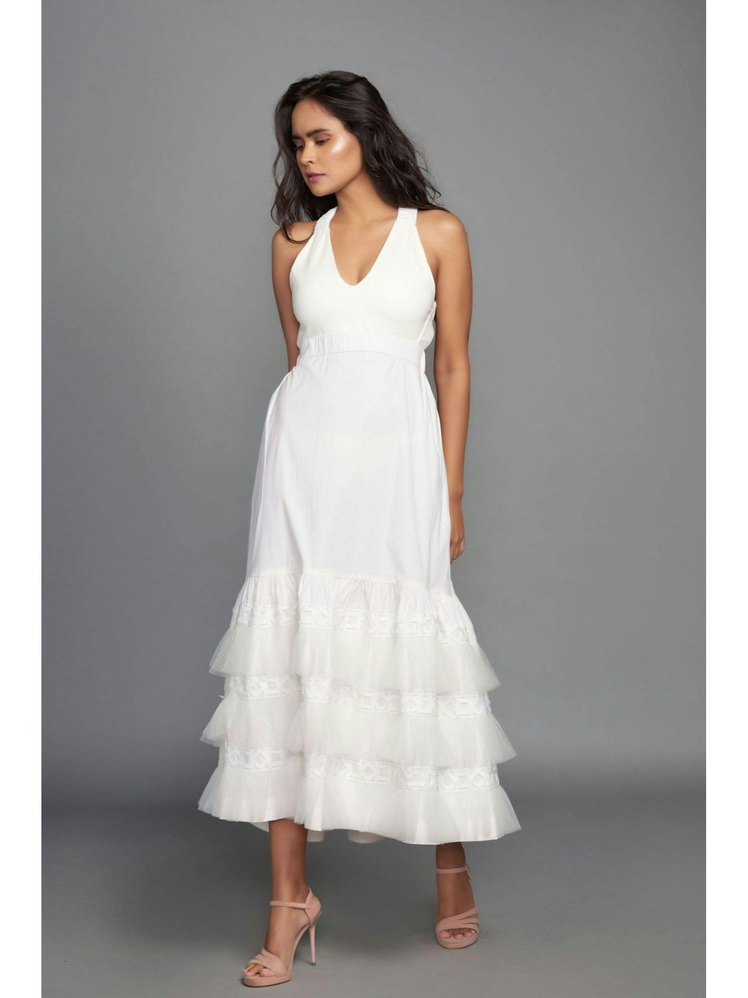white dress with cross back and pleated net and cutwork details on the bottom, a product by Deepika Arora
