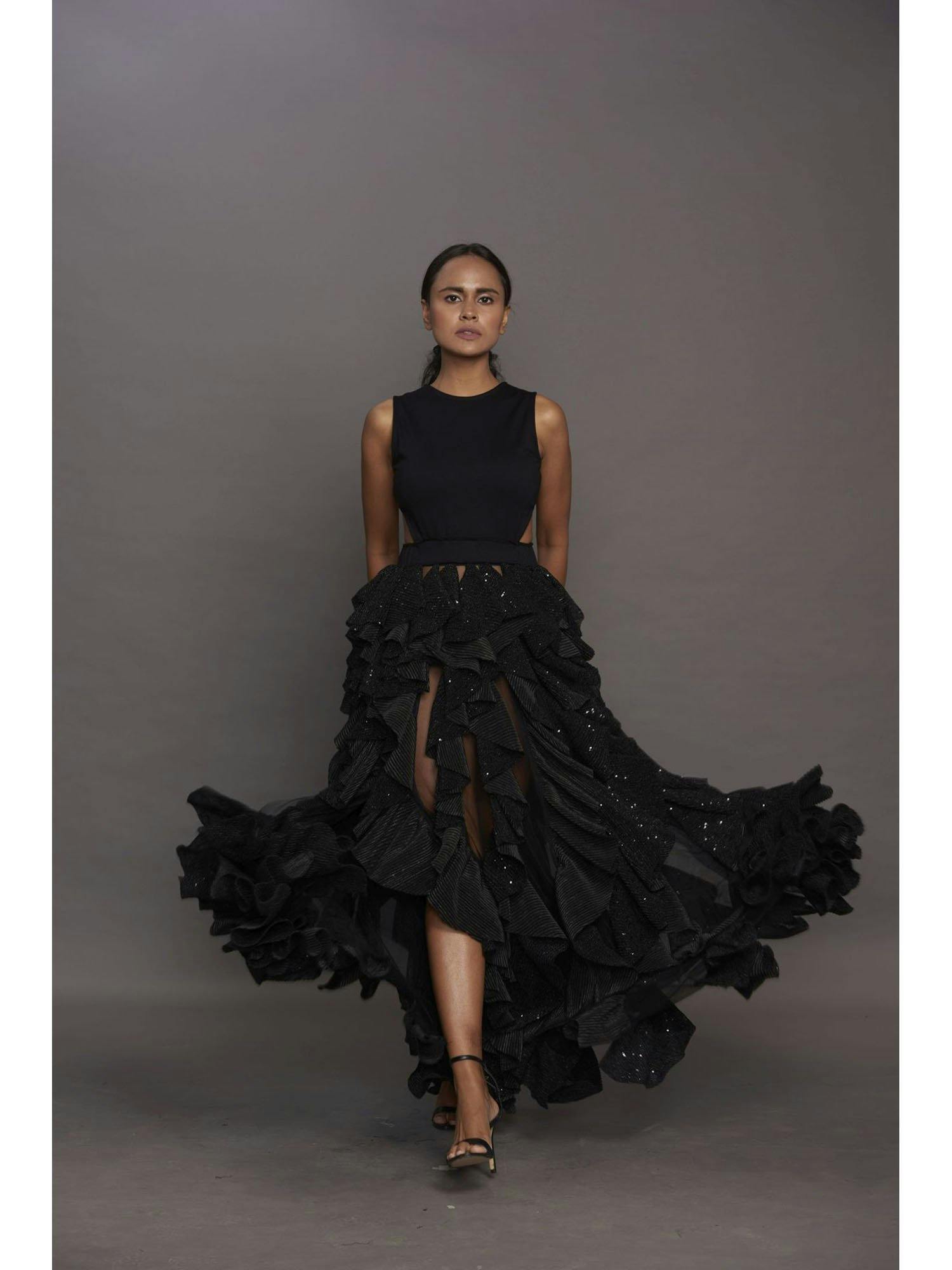 Black backless dress with ruffled bottom, a product by Deepika Arora