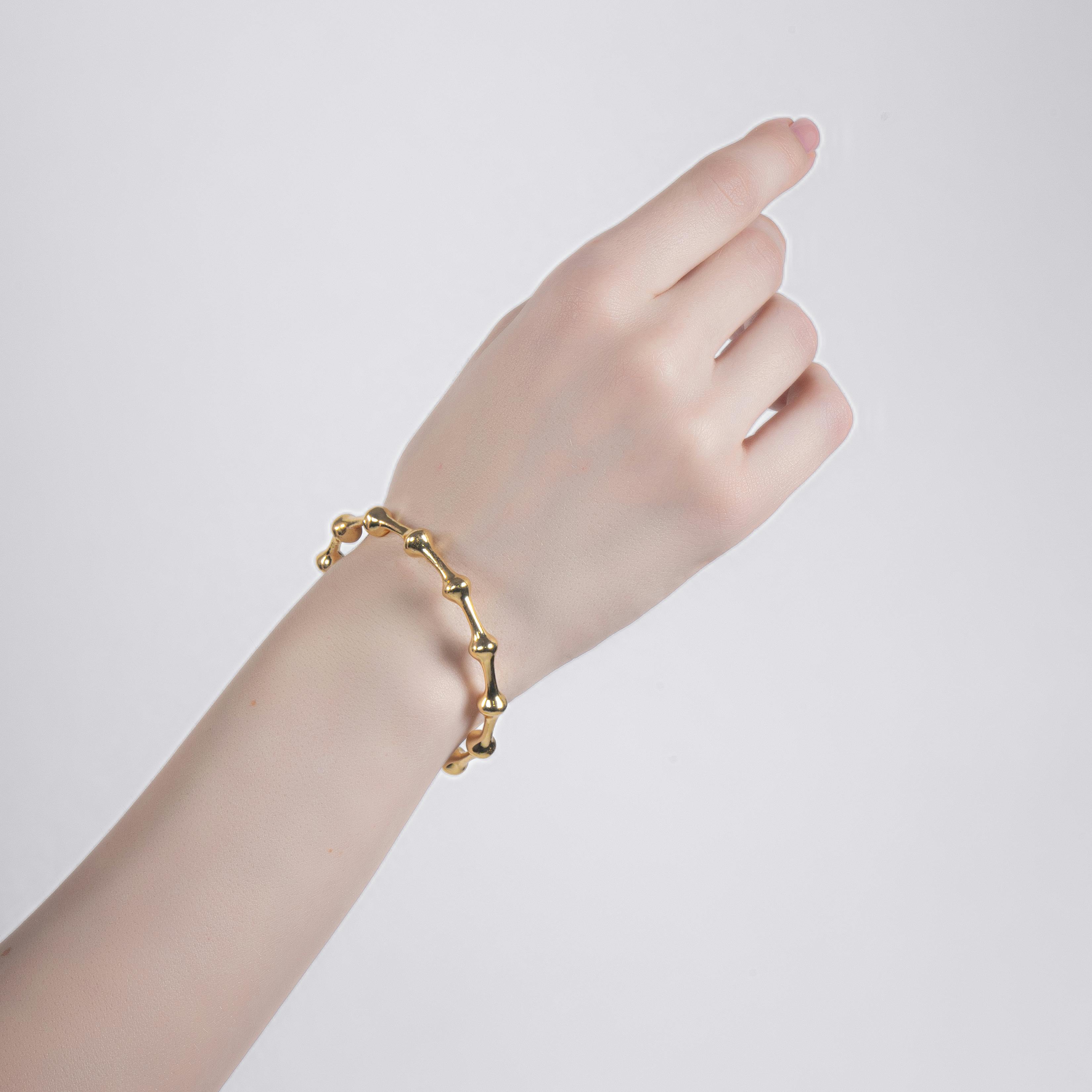 Thumbnail preview #4 for SYMPHONY BANGLE - GOLD TONE