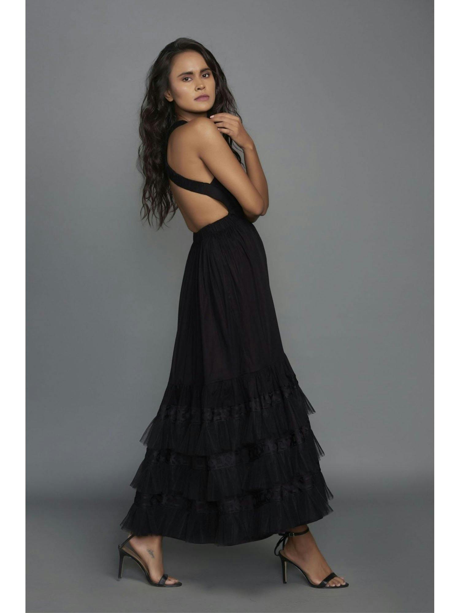 black dress with cross back and cutwork details on the bottom, a product by Deepika Arora