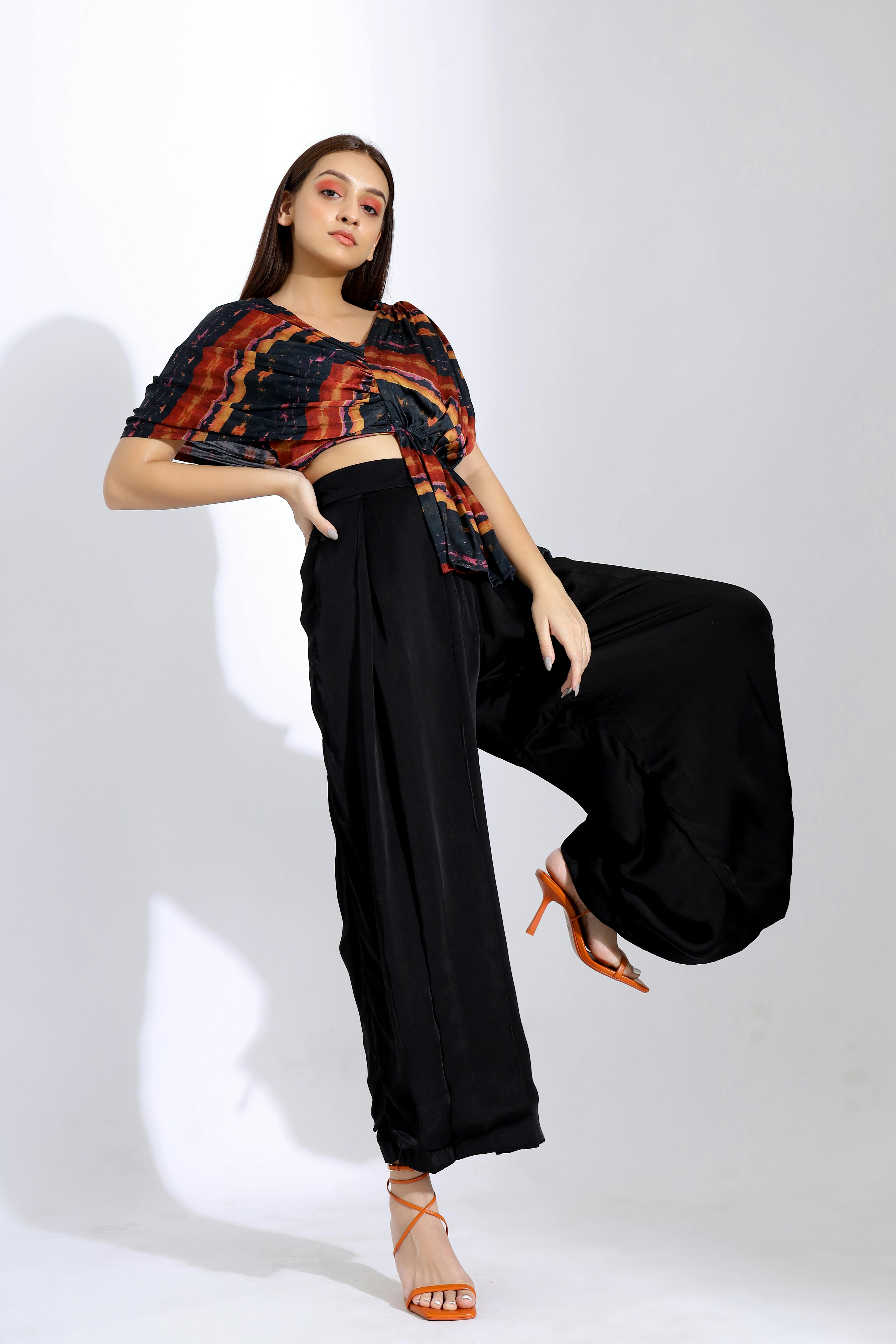 Draped blouse paired with flare pants, a product by Studio Surbhi