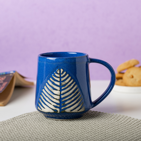 Blue Ceramic Coffee Mug with White Leaf Design, a product by The Golden Theory