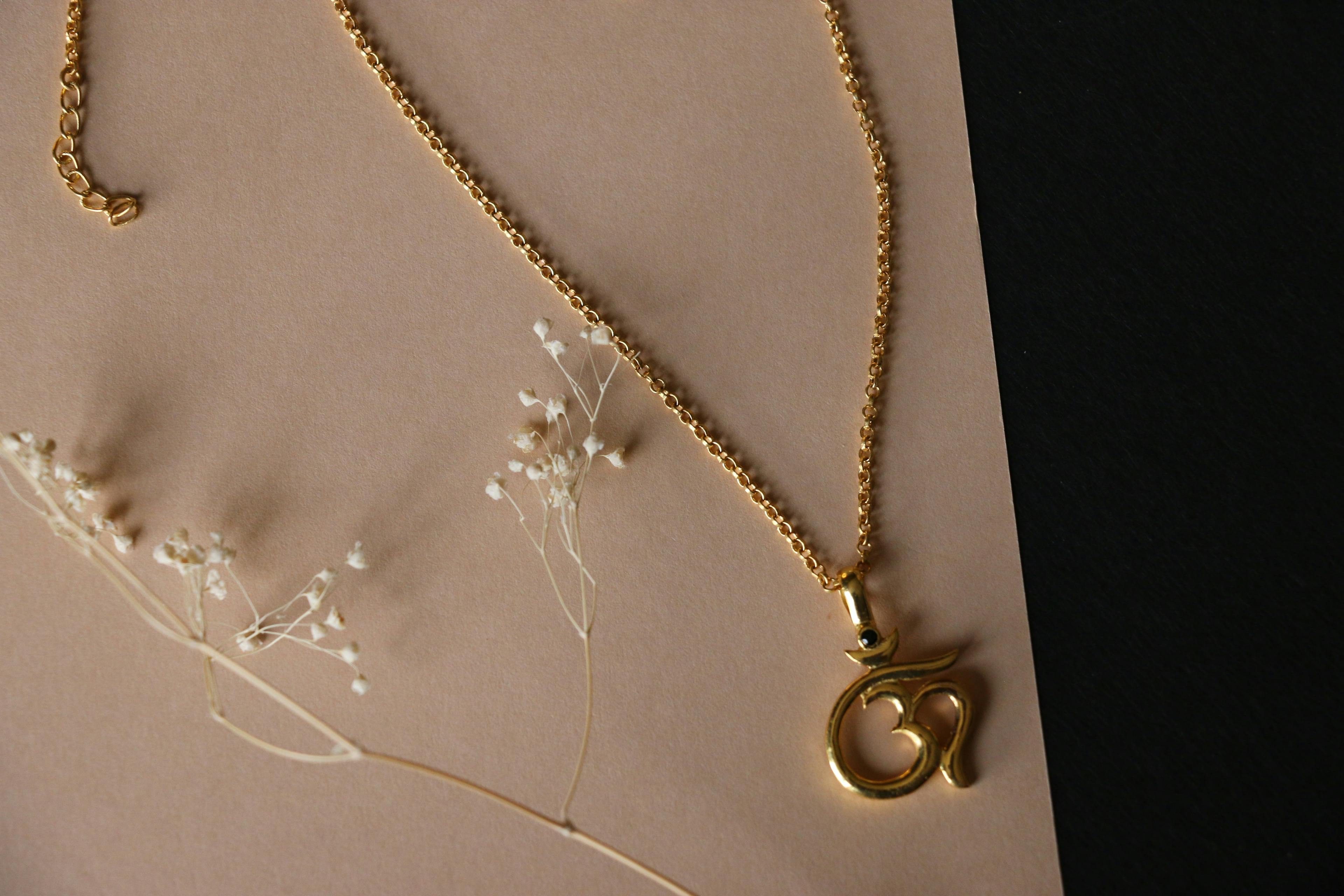 Om charm necklace, a product by The Jewel Closet Store