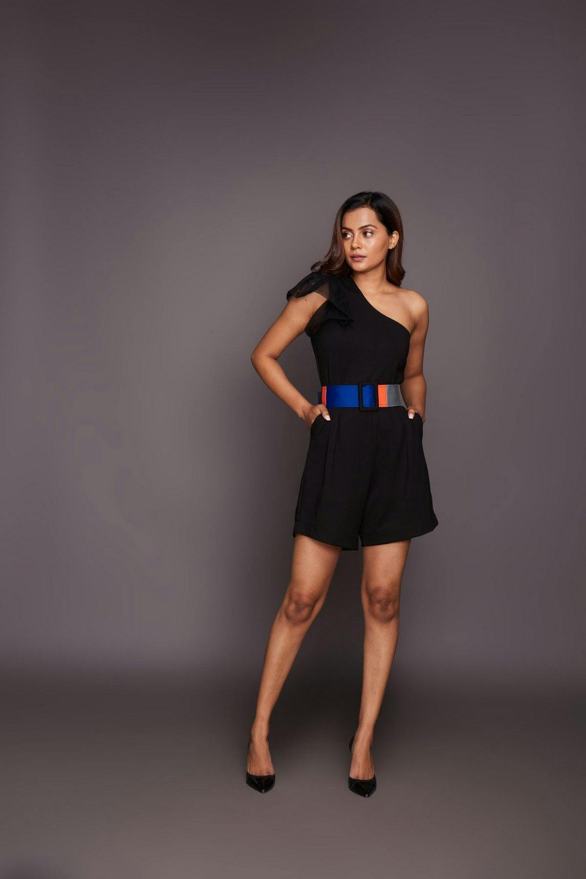 Black one shoulder playsuit comes with belt, a product by Deepika Arora