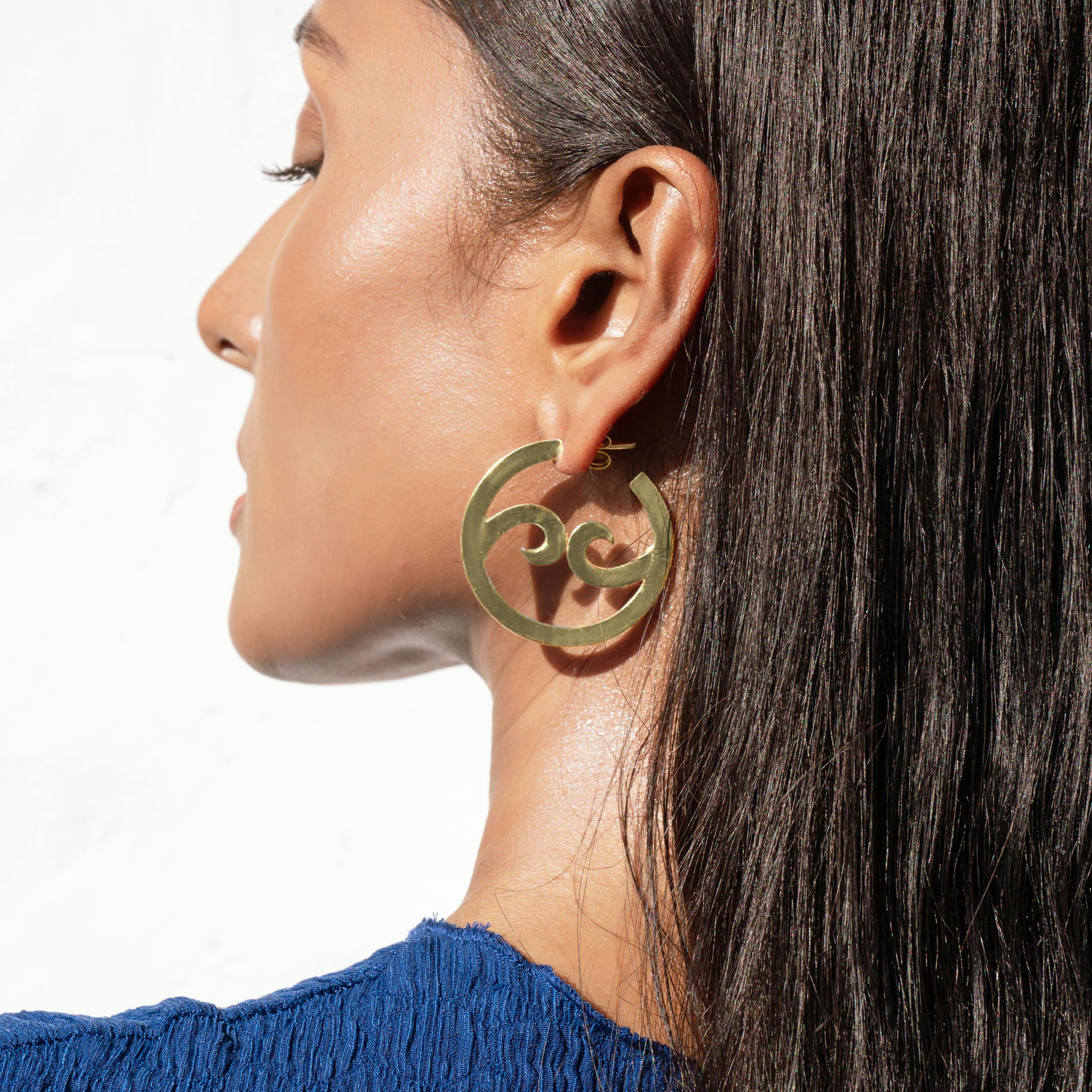 Thumbnail preview #1 for YIN YANG WAVE HOOPS - SMALL - GOLD TONE