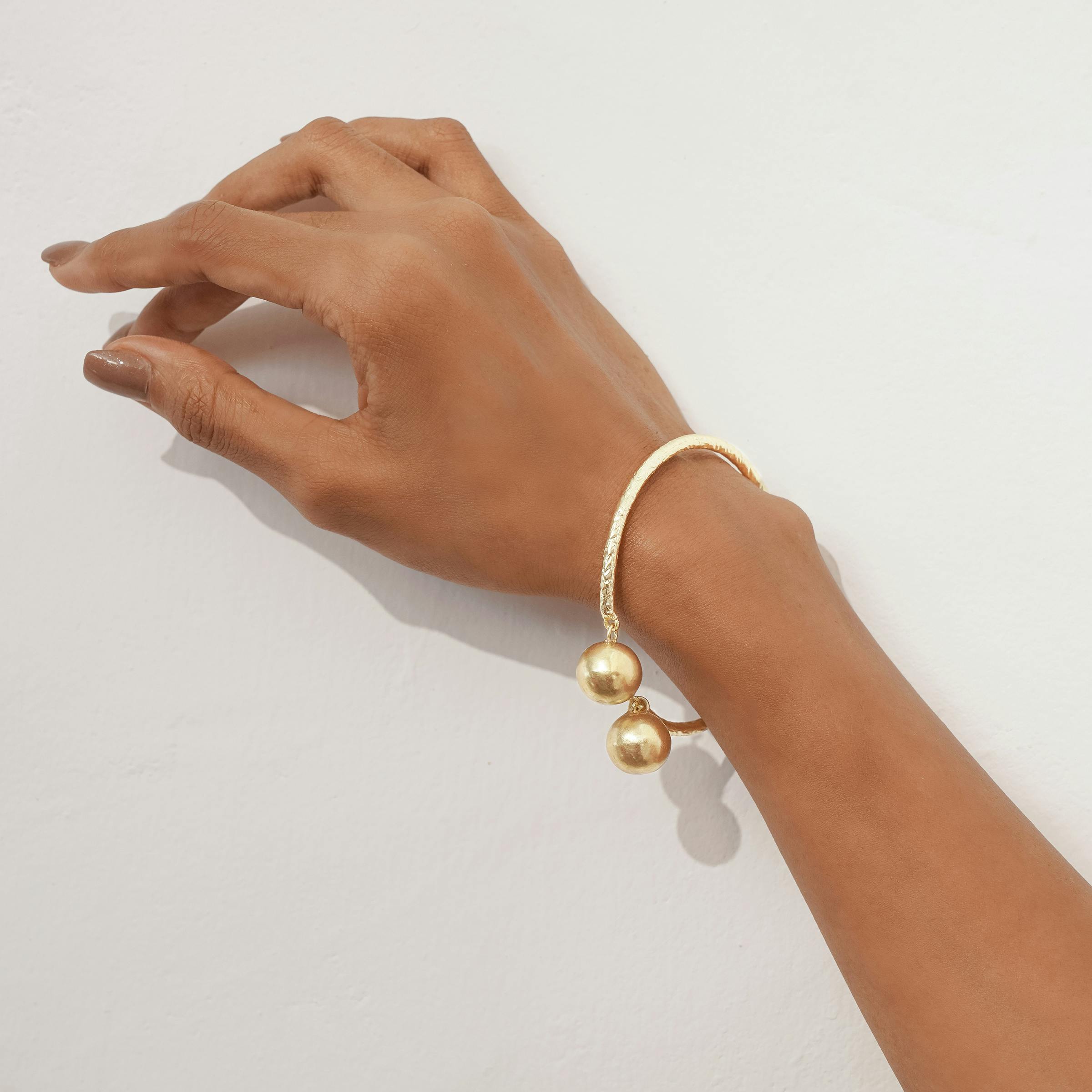 Thumbnail preview #2 for DUALDROP BANGLE - GOLD TONE