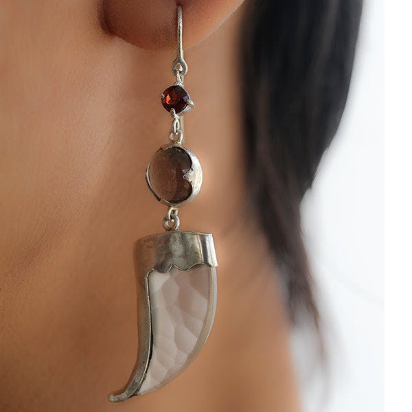 AVANI Silver Faux Tiger Claw Red Lens Earrings, a product by Baka