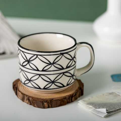 Black Floral White Color Ceramic Tea Cup with Design, a product by The Golden Theory