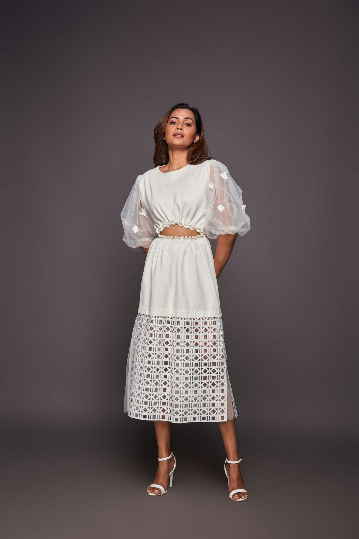 White dress with puffy sleeves and cutwork, a product by Deepika Arora