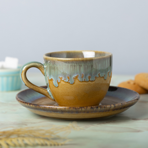 Golden and Blue Color Cup and Saucer, a product by The Golden Theory